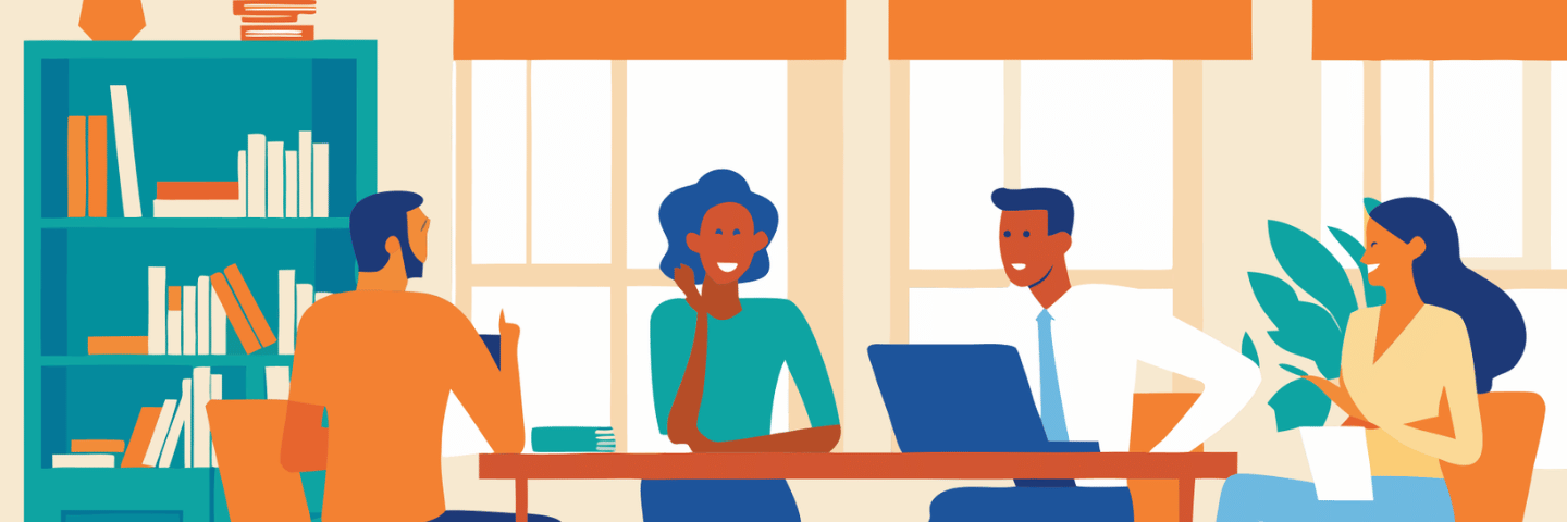 Colleagues in conversation in a shared workspace